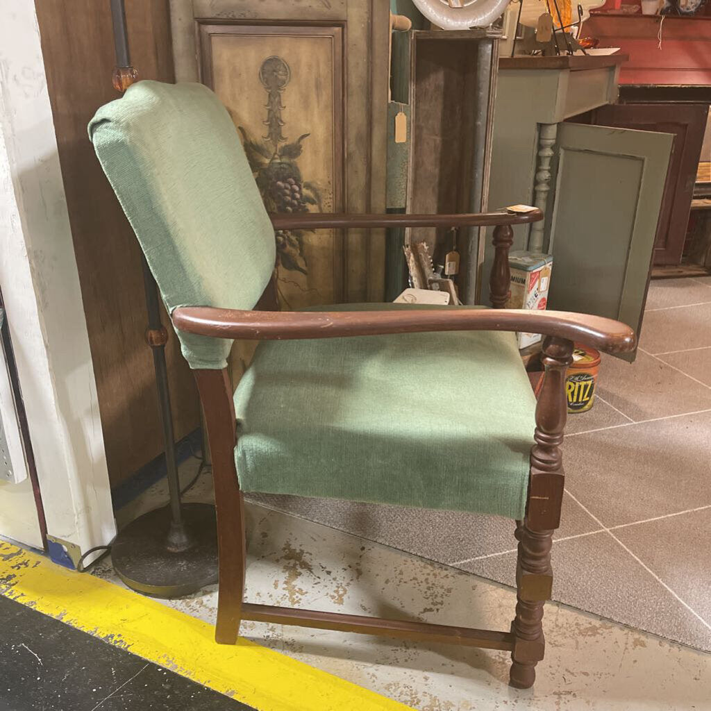 Green and wooden armed chair