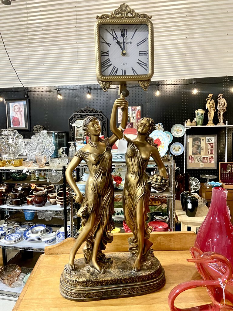 Tall clock with two women