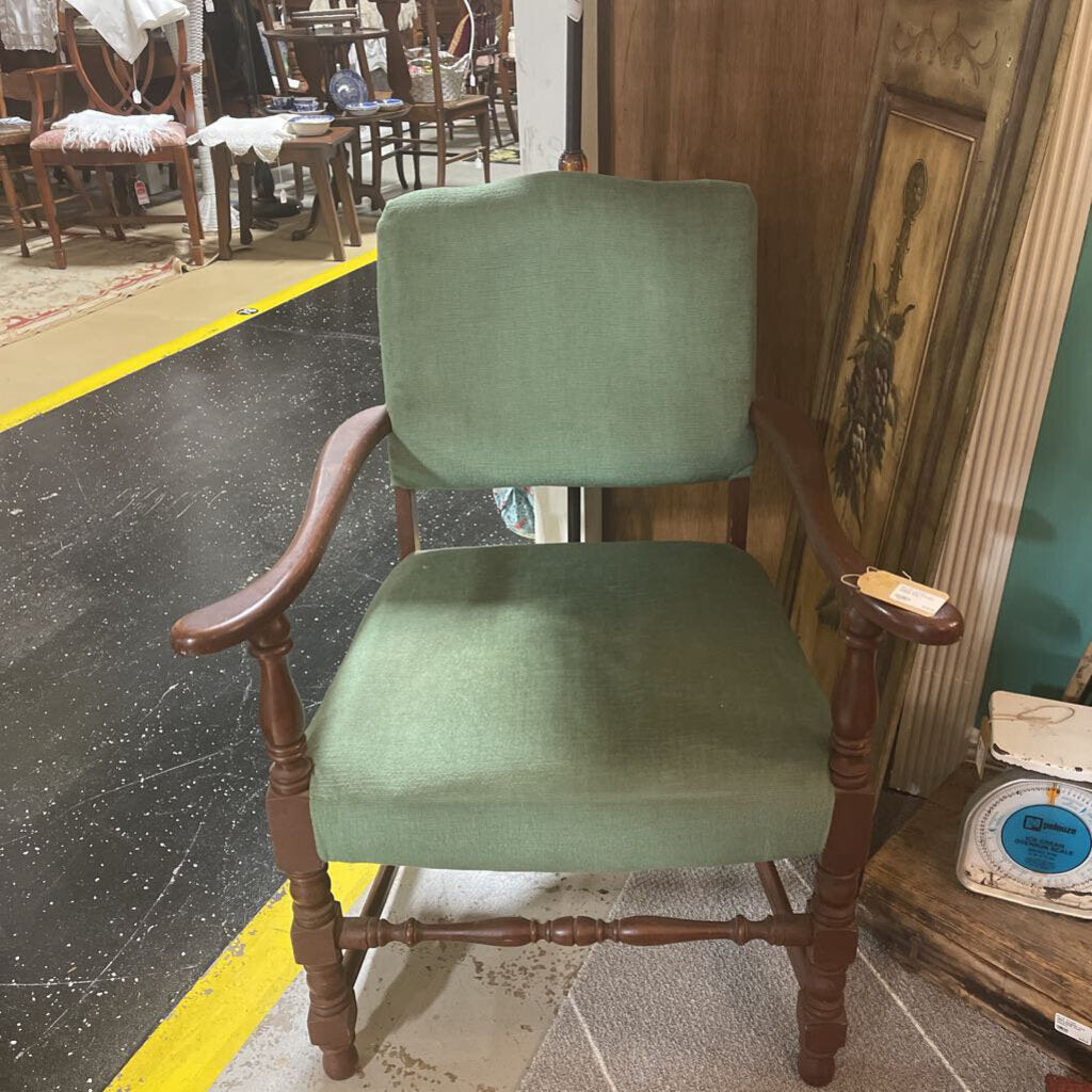 Green and wooden armed chair