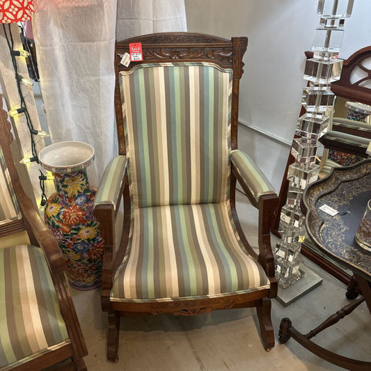 Wood carved upholstered rocking chair